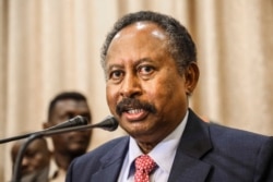 FILE - In this Aug. 21, 2019, file photo, Sudan's Prime Minister Abdalla Hamdok speaks at a news conference in Khartoum, Sudan.