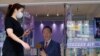 A woman walks past Foxconn's founder Terry Gou's presidential election campaign headquarter in Taipei, Taiwan, Oct. 24, 2023.