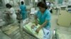 Nurses attend newborn babies at the Maternity hospital in Lima, Peru, Monday, Oct. 31, 2011. (AP Photo/Karel Navarro)