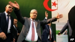 Governing FLN party chief Amar Saadani waves to supporters during a rally held in Algiers, Algeria, March 30, 2016.