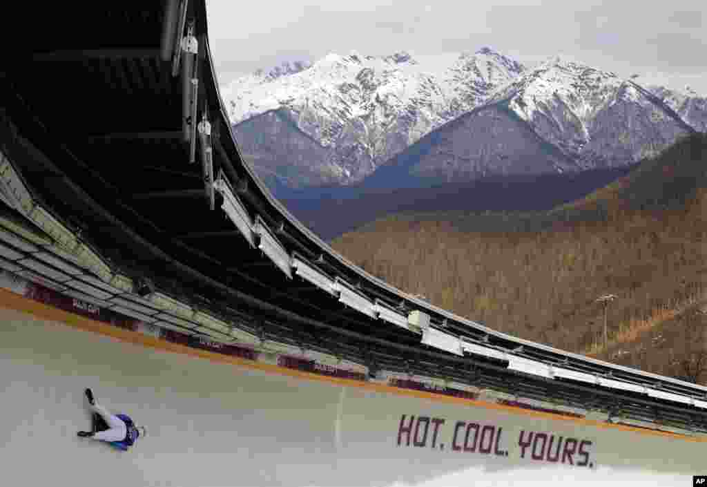 Alexandros Kefalas of Greece speeds down the track during a training session for men's skeleton, Krasnaya Polyana, Russia, Feb. 10, 2014.
