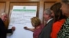 Britain's opposition Labour Party's shadow Chancellor John McDonnell, left, signs a cross-party declaration during an event with representatives of Britain's other pro-EU political parties, to discuss Brexit, in London, Aug. 27, 2019.