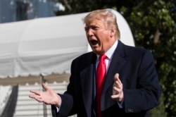 President Donald Trump speaks to reporters upon arrival at the White House in Washington, Nov. 3, 2019.