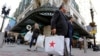 FILE - Shoppers carry bags through the Downtown Crossing of Boston, May 18, 2016. The University of Michigan said Jan. 18, 2019, that its consumer sentiment index had fallen 7.7 percent in early January to a reading of 90.7, the lowest reading since October 2016.