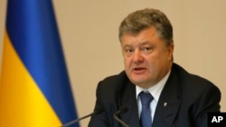 FILE - Ukrainian President Petro Poroshenko speaks during the expanded board of Ministry of Internal Affairs of Ukraine in Kyiv, Ukraine, July 10, 2015.