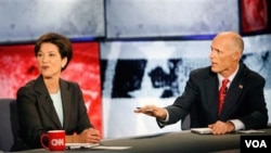 El nuevo gobernador de Florida, a la derecha en la foto, hablaba durante un debate de campaña.