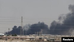FILE - Smoke is seen following a fire at Aramco facility in the eastern city of Abqaiq, Saudi Arabia, Sept. 14, 2019.
