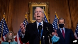Senate Majority Leader Mitch McMcConnell of Ky., speaks to reporters on Capitol Hill in Washington, Dec. 1, 2020. 