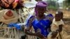 FILE - A United Nations report predicts a baby boom in Africa. Here, a woman carries her child in Nigeria's Kaduna State. 