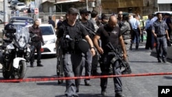 Israeli police secures the scene where a Palestinian gunman was shot dead in Jerusalem, Oct. 9, 2016.