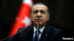 FILE - Turkish Prime Minister Recep Tayyip Erdogan addresses members of parliament from his ruling AK party at the parliament in Ankara, June 3, 2014.