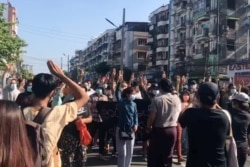 People protest in Hlaing Township, Yangon, Myanmar, May 2, 2021, in this still image from a video.
