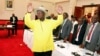 FILE - Ugandan President Yoweri Museveni gestures to delegates attending the Burundi peace talks at Entebbe State House, east of Kampala, Dec. 28, 2015.