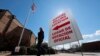 A sign points potential voters to an official polling location during early voting in Dallas, Feb. 26, 2020.