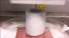 This video shows hyperelastic bone being 3-D-printed into forms, absorbing liquid and demonstrating elasticity.