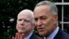 U.S. Senators Charles Schumer (D-NY), right, and John McCain (R-AZ), address media after White House immigration meetings, July 11, 2013.
