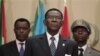 Equatorial Guinea President Teodoro Obiang (C) stands for the playing of the African Union anthem at the closing session of the 17th African Union Summit, at Sipopo Conference Center, outside Malabo, Equatorial Guinea, July 1, 2011.