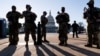 Members of the Michigan National Guard and the US Capitol Police keep watch as heightened security remains in effect around the Capitol grounds since the Jan. 6 attacks by a mob of supporters of then-President Donald Trump, in Washington, March 3, 2021.