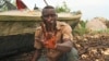 A fisherman shows an oil slick on his palm, by the shore of the Niger Delta region in Brass, Nigeria, Dec. 2, 2013.