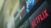 FILE - The Netflix logo is pictured on a television in this illustration photograph taken in Encinitas, Calif., Jan. 18, 2017. 
