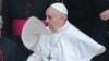 Newly elected Pope Francis, Cardinal Jorge Mario Bergoglio of Argentina 's cape blows in the wind as he leaves the Santa Maria Maggiore Basilica in Rome, March 14, 2013. 