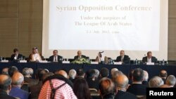 Arab League head Nabil El-Arabi (C) speaks at the Syrian Opposition Conference in Cairo, Egypt, July 2, 2012. 