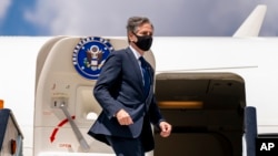 Secretary of State Antony Blinken boards his plane at Jomo Kenyatta International Airport in Nairobi, Kenya, Thursday, Nov. 18, 2021, to travel to Abuja, Nigeria. Blinken is on a five day trip to Kenya, Nigeria, and Senegal.