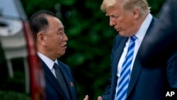 FILE - President Donald Trump shakes hands with Kim Yong Chol, former North Korean military intelligence chief, after their meeting in the Oval Office of the White House in Washington, June 1, 2018. The two also met for talks in Washington on Jan. 18, 201