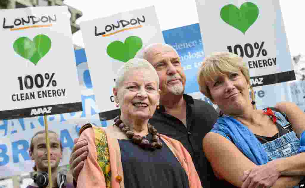 From left, Designer Vivienne Westwood, musician Peter Gabriel and actress Emma Thompson join an estimated 40,000 people marching from the Embankment via Whitehall to the Houses of Parliament as part of the People's Climate March, in central London, Sept. 21, 2014. 