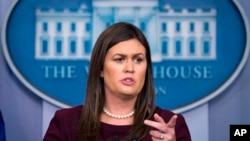 White House press secretary Sarah Sanders speaks to the media during the daily press briefing at the White House, Aug. 14, 2018.