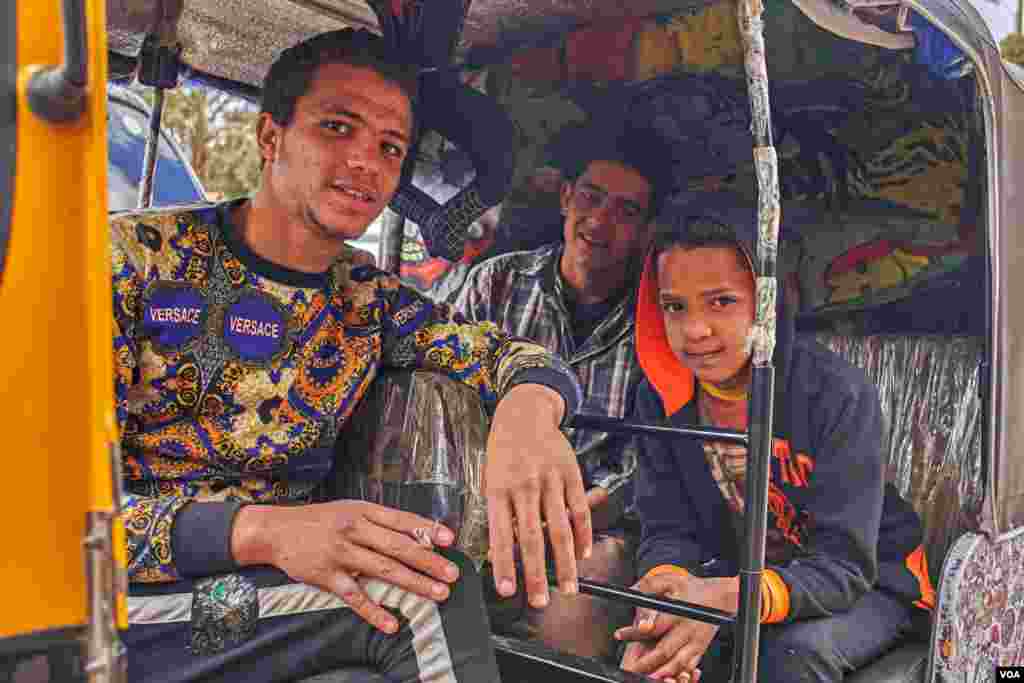 Toktok driver Akram says, "Driving toktok is much better than wasting time with friends on coffee shops or sharing a rolled cigarette. On my toktok, I can make money." (H. Elrasam/VOA)
