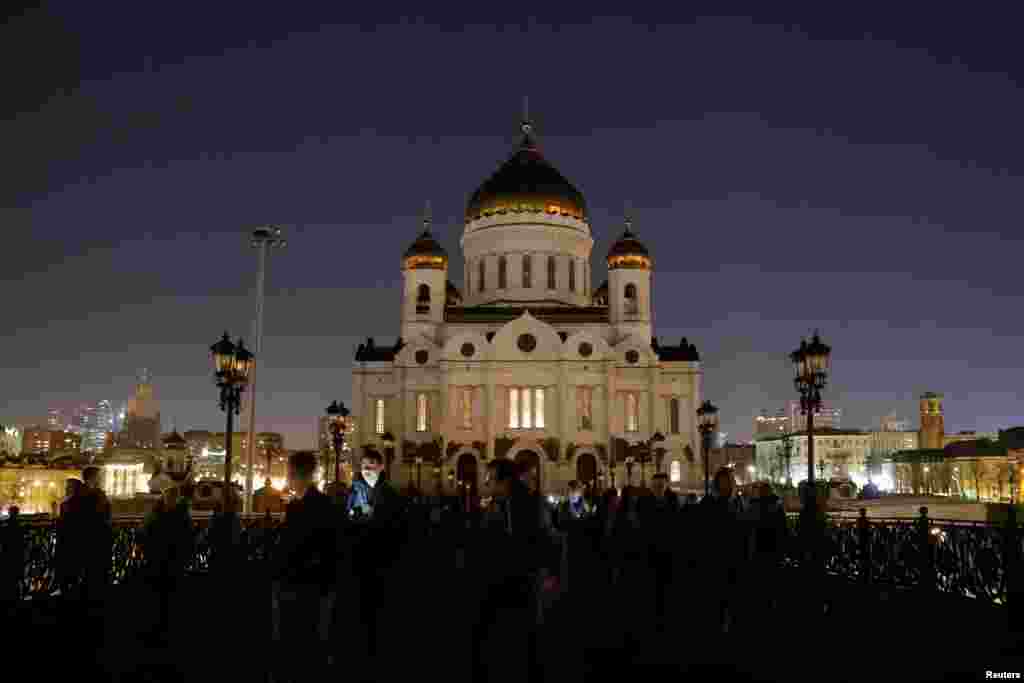 The Cathedral of Christ the Saviour is seen after the lights are switched off for Earth Hour in Moscow, March 30, 2019.
